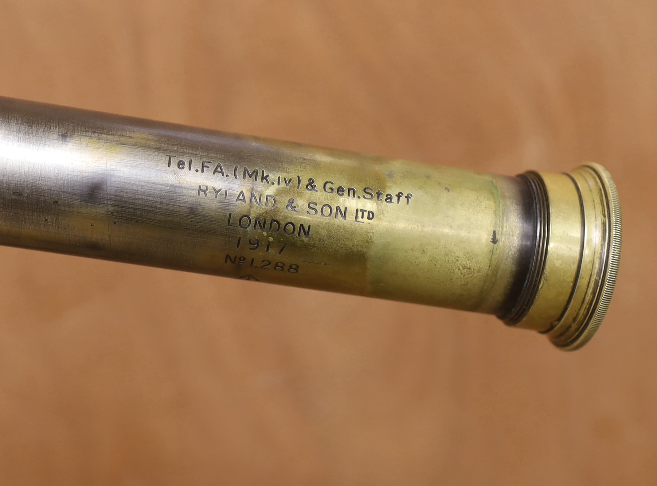 A WWI leather cased telescope and tripod, 57cm